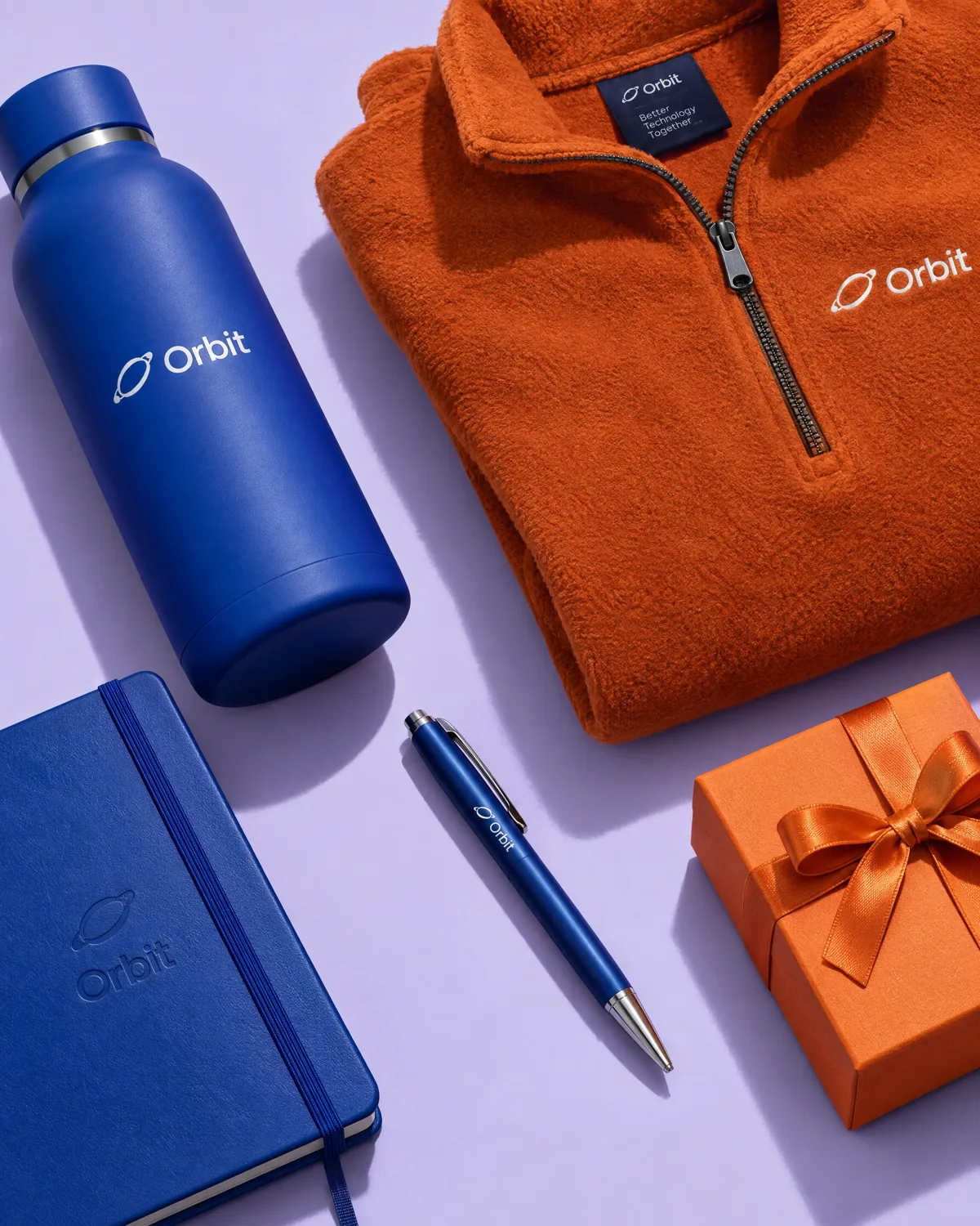 Notebook, bottle, quarter zip, pen and gift box